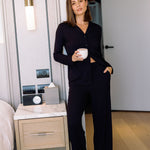 Model wearing a full-length view of drawstring ribbed lounge pants